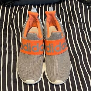 adidas women’s Grey with Orange Elastic Logo Slip-On Sneakers